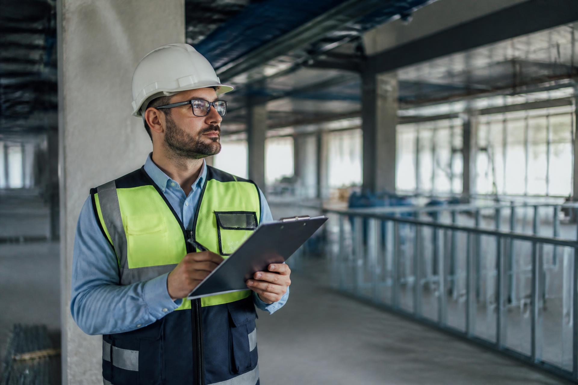 Health and safety consultant carrying out an inspection on a commercial construction site
